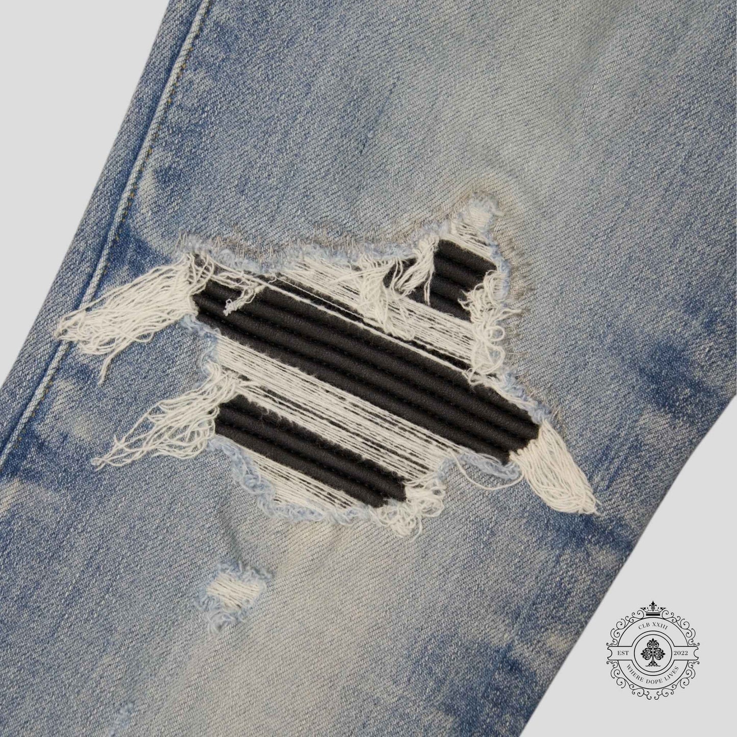 Amiri MX1 Leather Patch Jeans in Light Indigo
