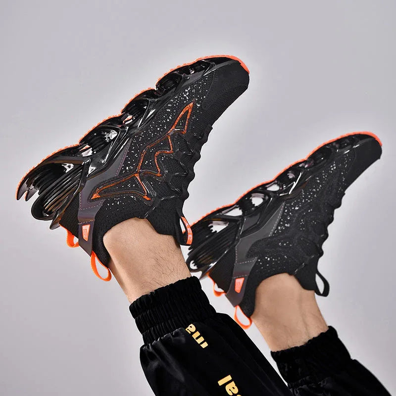 Nova Sole T84 Sneakers in black and orange shown mid-air with dynamic sole - LUXURYURBANWEAR mesh sneakers.