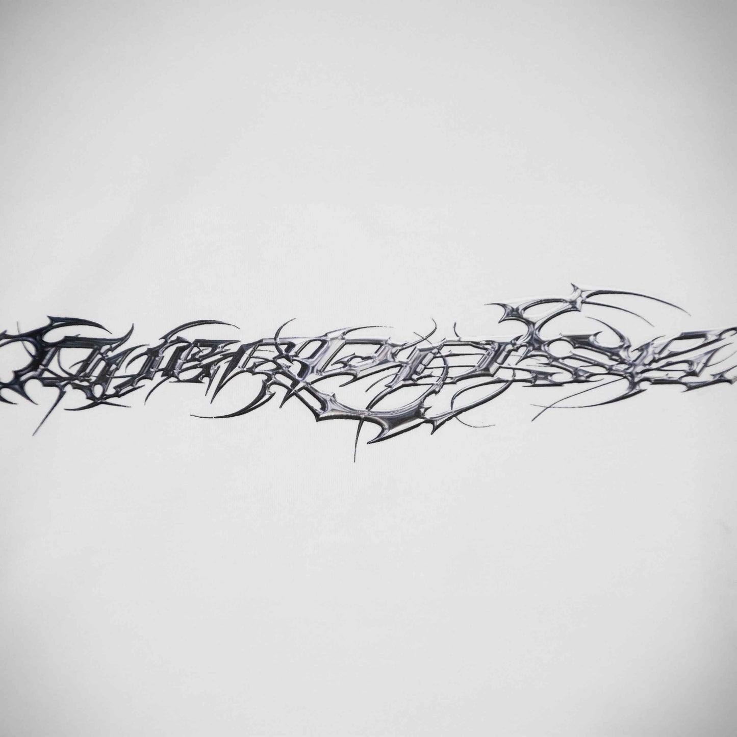 "TRIBAMETAL" LOGO TRNSFRMR L/S - ANGEL