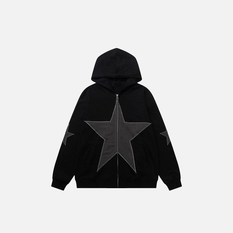 Front view of model wearing a black star graphic zip-up hoodie with oversized fit