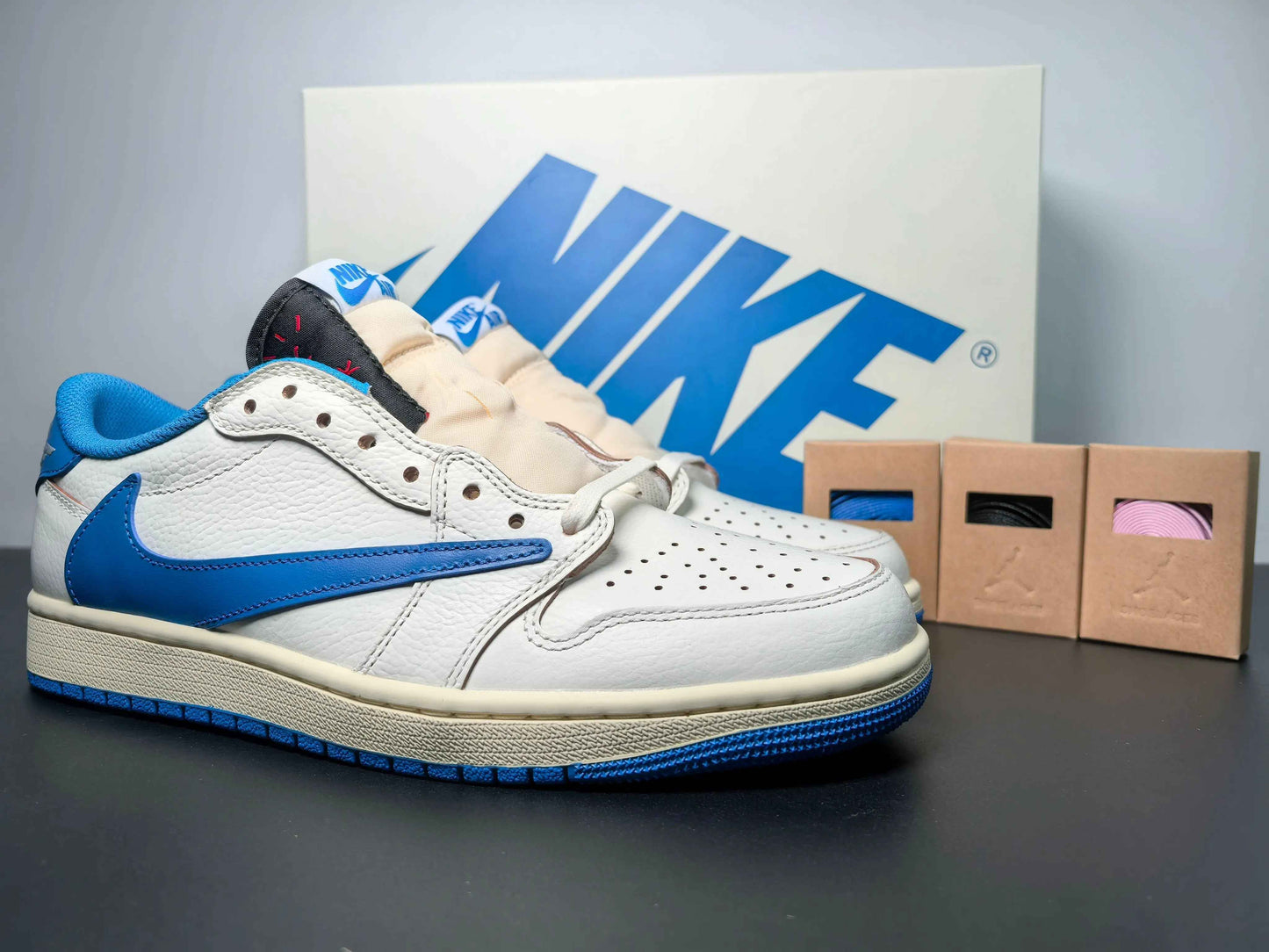 Custom white and blue Air Jordan 1 low-top sneakers with extra laces, luxury urbanwear style