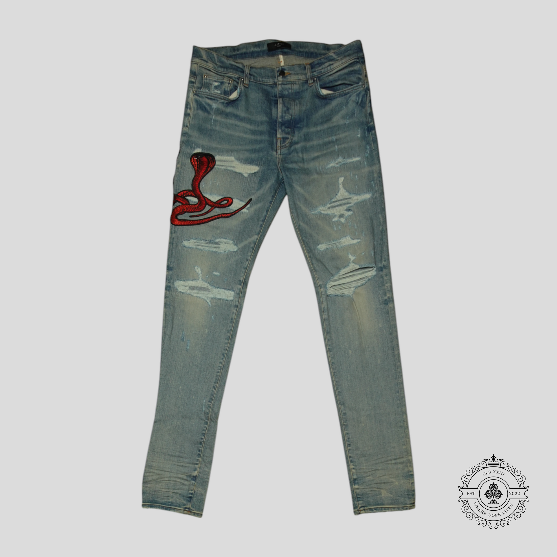 Amiri Red Poison Archival Jeans in Medium Wash