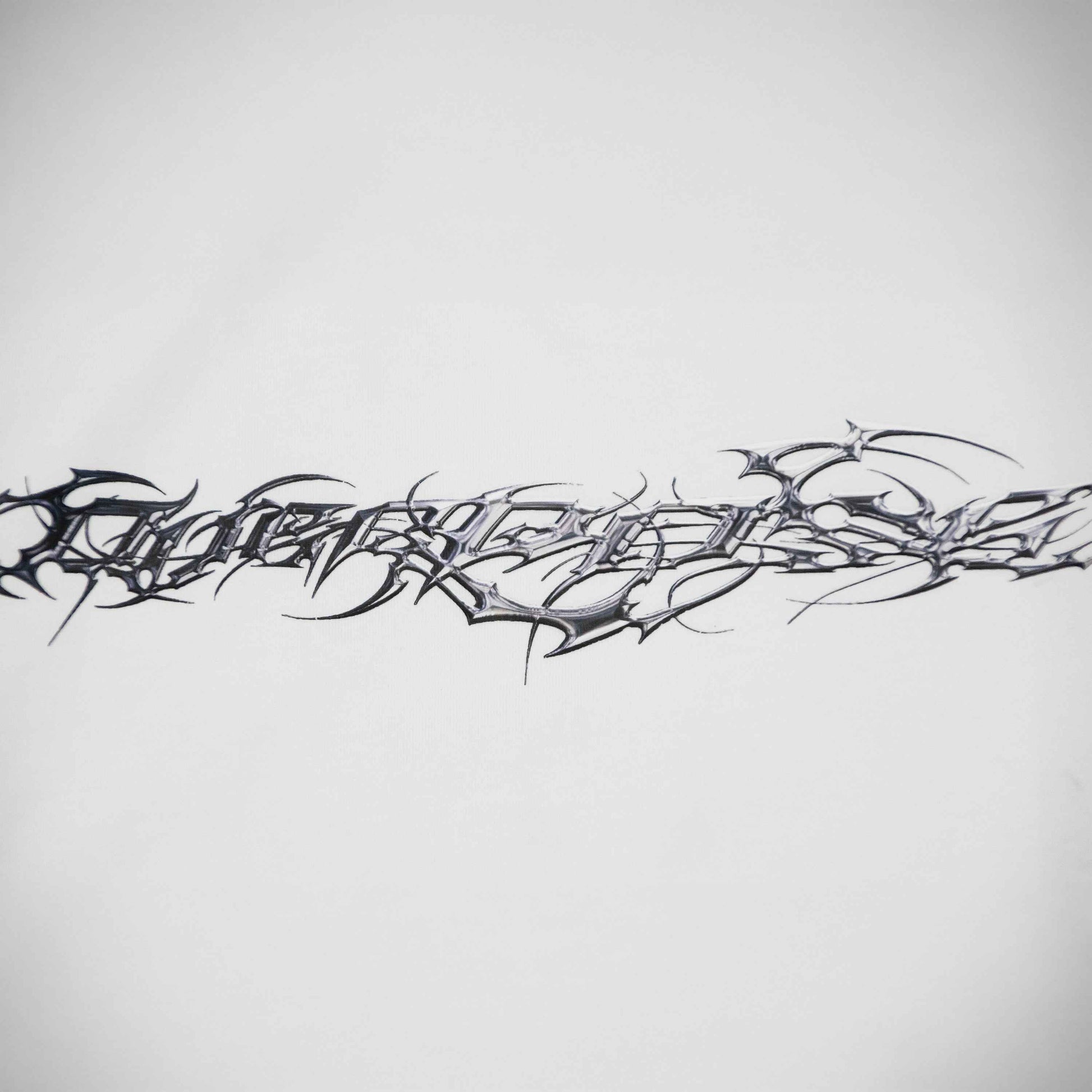 "TRIBAMETAL" LOGO TRNSFRMR L/S - ANGEL