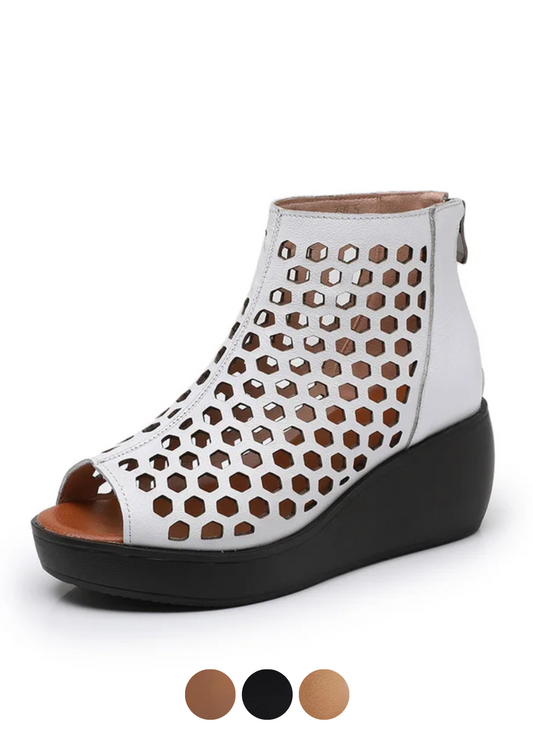 White luxury urban wedge sandal with hexagonal cutouts and black sole, modern streetwear style