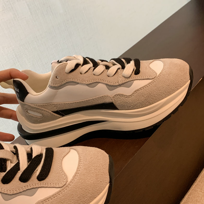 Luxuryurbanwear women’s round toe lace-up sneaker in white, grey, and black suede on display